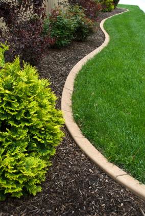 Landscape edging in North Oxford, MA by Shepherd Lawn Maintenance LLC.